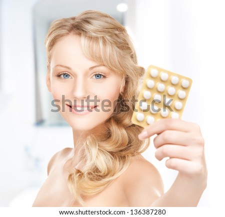 picture of young woman with pills at home