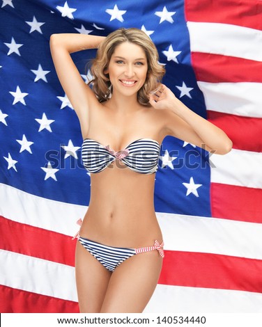 picture of beautiful smiling woman in bikini over american flag
