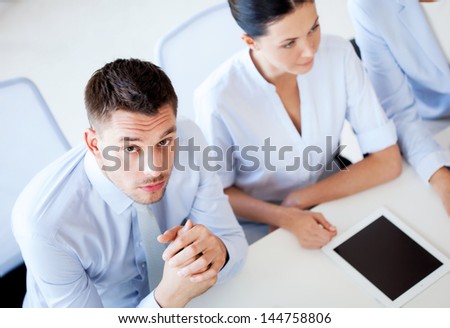picture of serious businessman on meeting in office