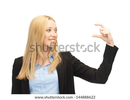 picture of beautiful young businesswoman holding something imaginary