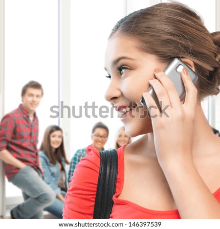 education and communication concept - student girl with cell phone at school