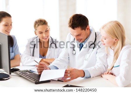 healthcare and medical concept - young team or group of doctors on meeting