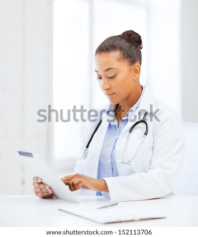 healthcare, medical and technology concept - african female doctor with tablet pc
