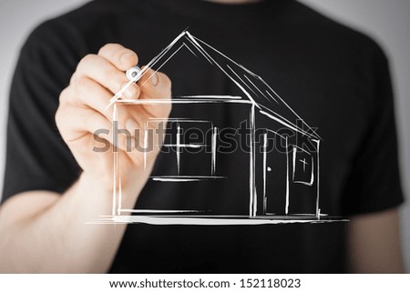 real estate, technology and accomodation - picture of man drawing a house on virtual screen
