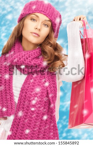 holidays, sale, shopping, christmas concept - beautiful woman in winter clothes with shopping bags