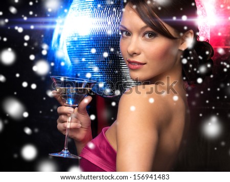 luxury, vip, nightlife, party, christmas, x-mas, new year\'s eve concept - beautiful woman in evening dress with cocktail and disco ball