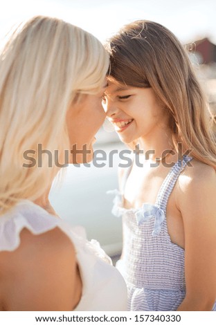 summer holidays, family, children and people concept - happy mother and child girl