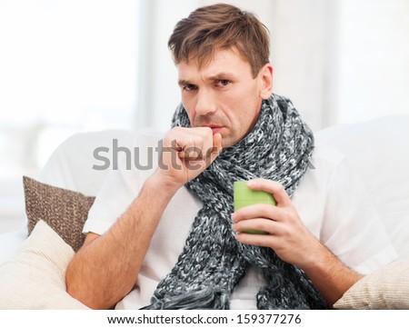 healthcare and medicine concept - ill man with flu at home