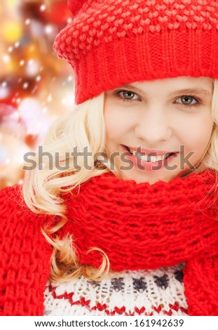 winter, christmas, xmas, x-mas, people, happiness concept - teenage girl in red hat and scarf