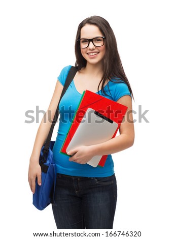 education, technology and people concept - smiling student wearing black eyeglasses with bag, folders and tablet pc computer standing