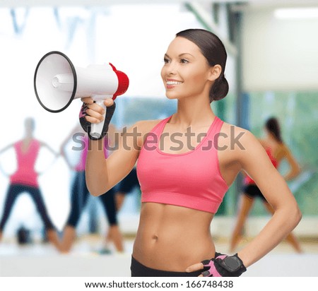 gym, sport and training concept - beautiful sporty woman with megaphone