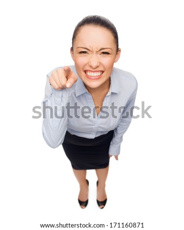 business and emotion concept - angry businesswoman pointing finger at you