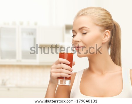 health, food and diet concept - close up of young woman drinking tomato juice