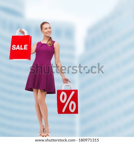beauty, fashion, shopping and happy people concept - young woman in purple dress and high heels with sale and discount shopping bags