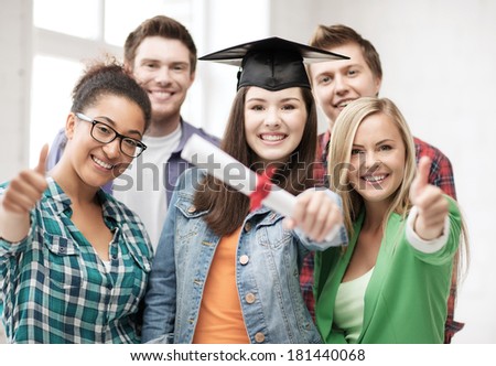 education concept - happy girl in graduation cap with diploma and students