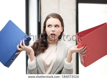 business concept - unsure thinking or wondering woman with folder