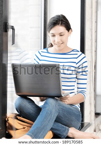 education and technology concept - happy teenage girl with laptop computer