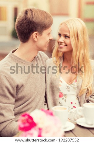 summer holidays, love, travel, tourism, relationship and dating concept - romantic happy couple in the cafe