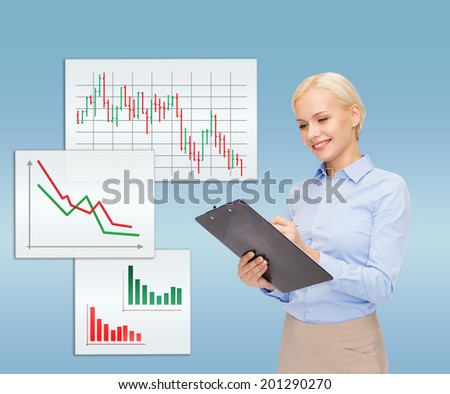 business, finances and education concept - friendly young smiling businesswoman with clipboard and pen