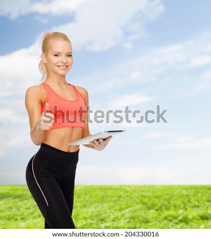 sport, exercise, technology, internet and healthcare - smiling sporty woman with tablet pc computer showing thumbs up