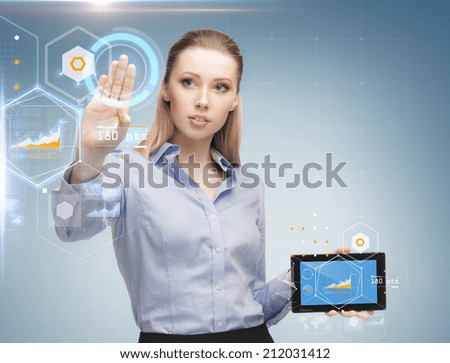 business, future technology, development and people concept - young businesswoman working with tablet pc and graph projections