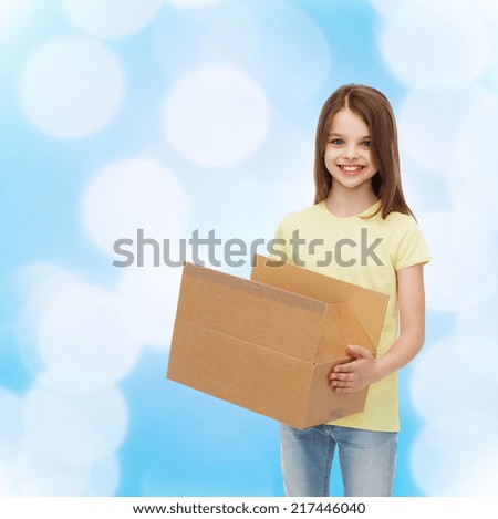 advertising, childhood, delivery, mail and people - smiling little girl holding open cardboard box over blue background