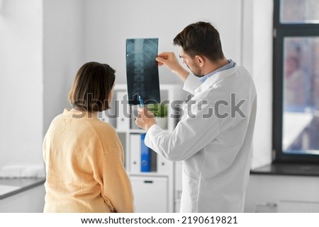 Similar – Image, Stock Photo Young doctor with x-ray film document on wall