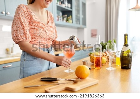 Similar – Image, Stock Photo Woman pouring cocktail in metal mug