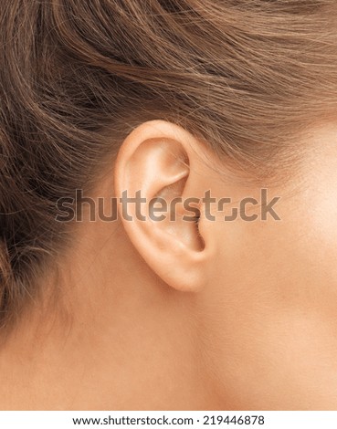 hearing, health, beauty and piercing concept - close up of woman\'s ear