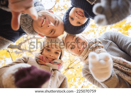 family, childhood, season, gesture and people concept - happy family pointing finger on you in autumn park
