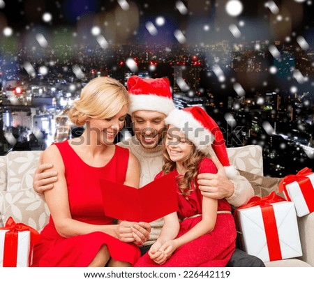christmas, holidays,  family and people concept - happy mother, father and little girl in santa helper hats with gift boxes over snowy night city background