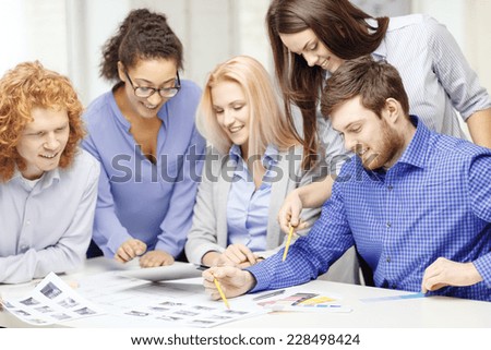 business, office, architecture and startup concept - smiling creative team with color samples at office