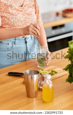 Similar – Image, Stock Photo Homemade refreshing mocktail with soda and orange juice