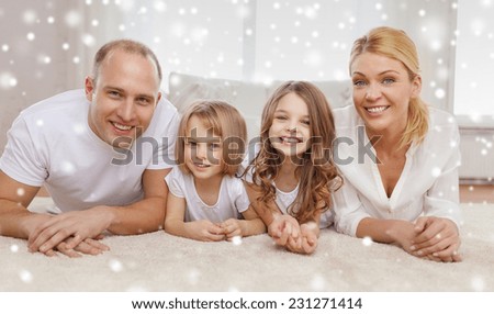 family, childhood, people and home concept - smiling parents with two little girls talking at home