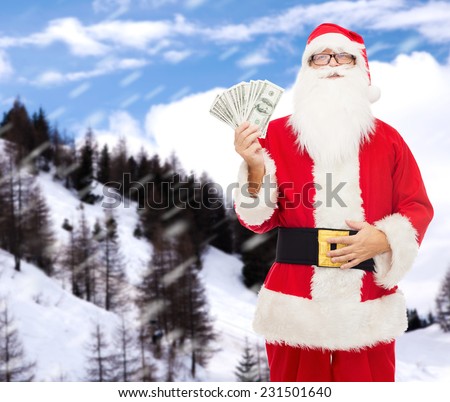 christmas, holidays, winning, currency and people concept - man in costume of santa claus with dollar money over snowy mountains