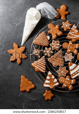 Similar – Image, Stock Photo Gingerbread cookies in different shapes on a blue background. Homemade Christmas cookies
