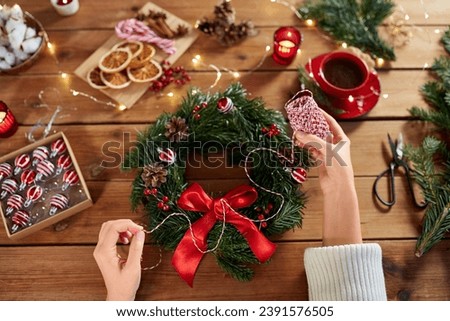 Image, Stock Photo Woman making Christmas wreath of spruce, step by step. Concept of florist’s work before the Christmas holidays.