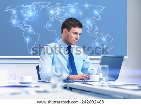 business, people and work concept - businessman with laptop computer and virtual world map sitting in office
