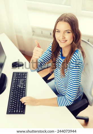 hone, technology and education concept - dreaming teenage girl with computer showing thumbs up at home