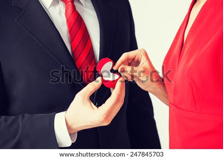 picture of couple with wedding ring and gift box