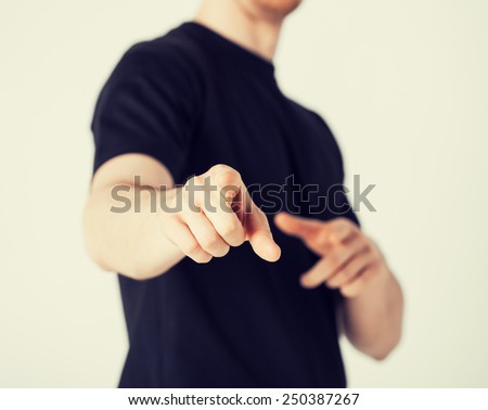 close up of man pointing his finger at you