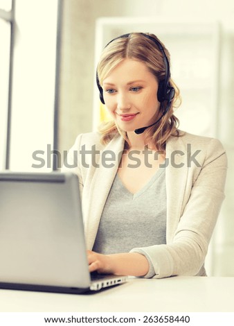 picture of helpline operator with laptop computer.