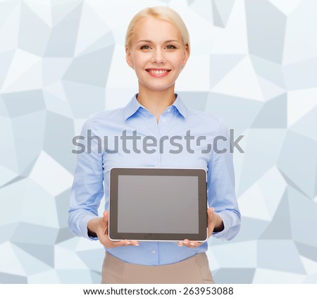 business, technology, internet and advertisement concept - smiling businesswoman with blank black tablet pc computer screen over gray graphic low poly background