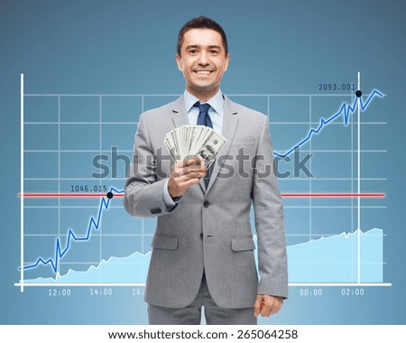 business, people, success and finances concept - smiling businessman with american dollar money over growing chart and blue background