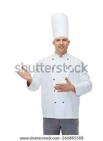 cooking, profession and people concept - happy male chef cook inviting