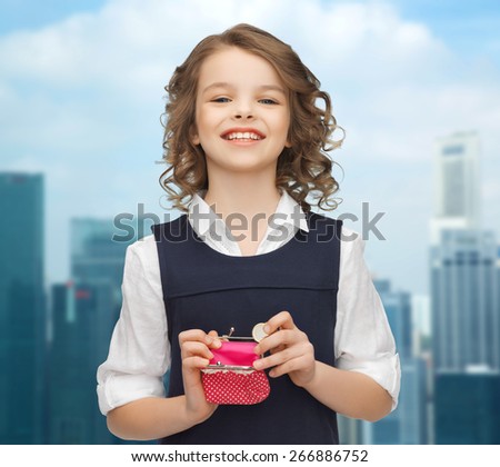 finances, childhood, people, money and savings concept - happy little girl with purse and euro coin over city background