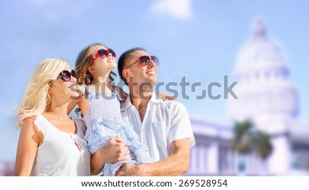 summer holidays, travel, tourism and people concept - happy family over american white house background
