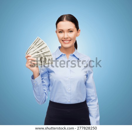 business and money concept - young businesswoman with dollar cash money over blue background
