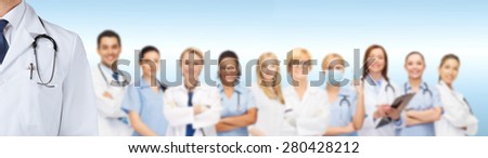 medicine, profession, teamwork and healthcare concept - international group of smiling medics or doctors over blue background