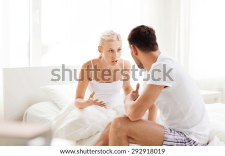 people, relationship difficulties, conflict and family concept - unhappy couple having argument at bedroom